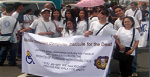 MCCID students parading with banner