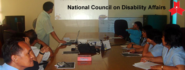 Sir Jojo presents the web design plan to NCDA employees and staff.