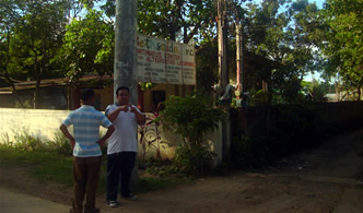 Sir Ervin Reyes and Bethsaida's Deaf Teacher Mamerto Cortez Jr. in front of Bethsaida's main campus.