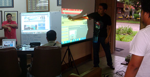 Sirs Ervin and Jerome explain to the clients the websites they designed.