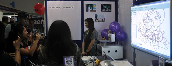 Students try out a laser drawing tool called PointDraw.