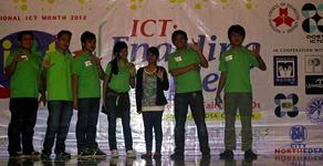 MCCID College faculty and students pose in front of ICT for PWD stage.