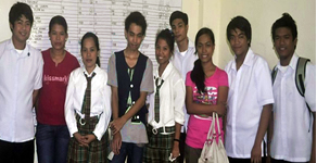 Winning team pose in front of the camera after the announcement of results.