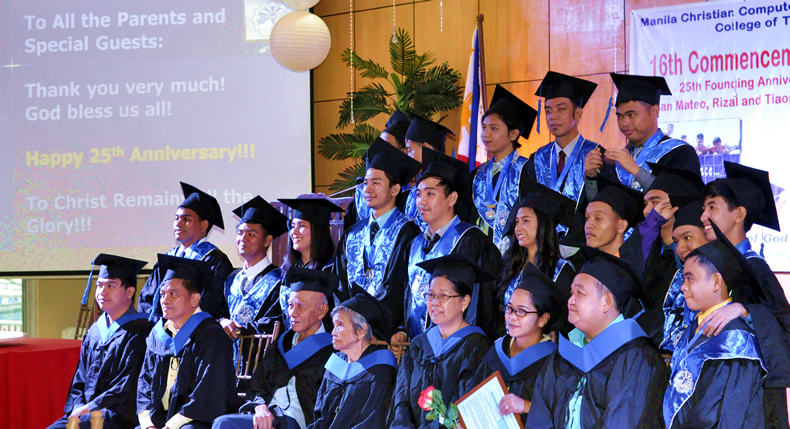 Graduating class pose together with administration and faculty